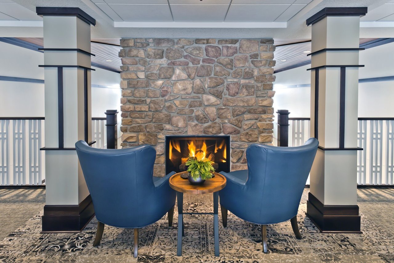 chairs facing stone fireplace