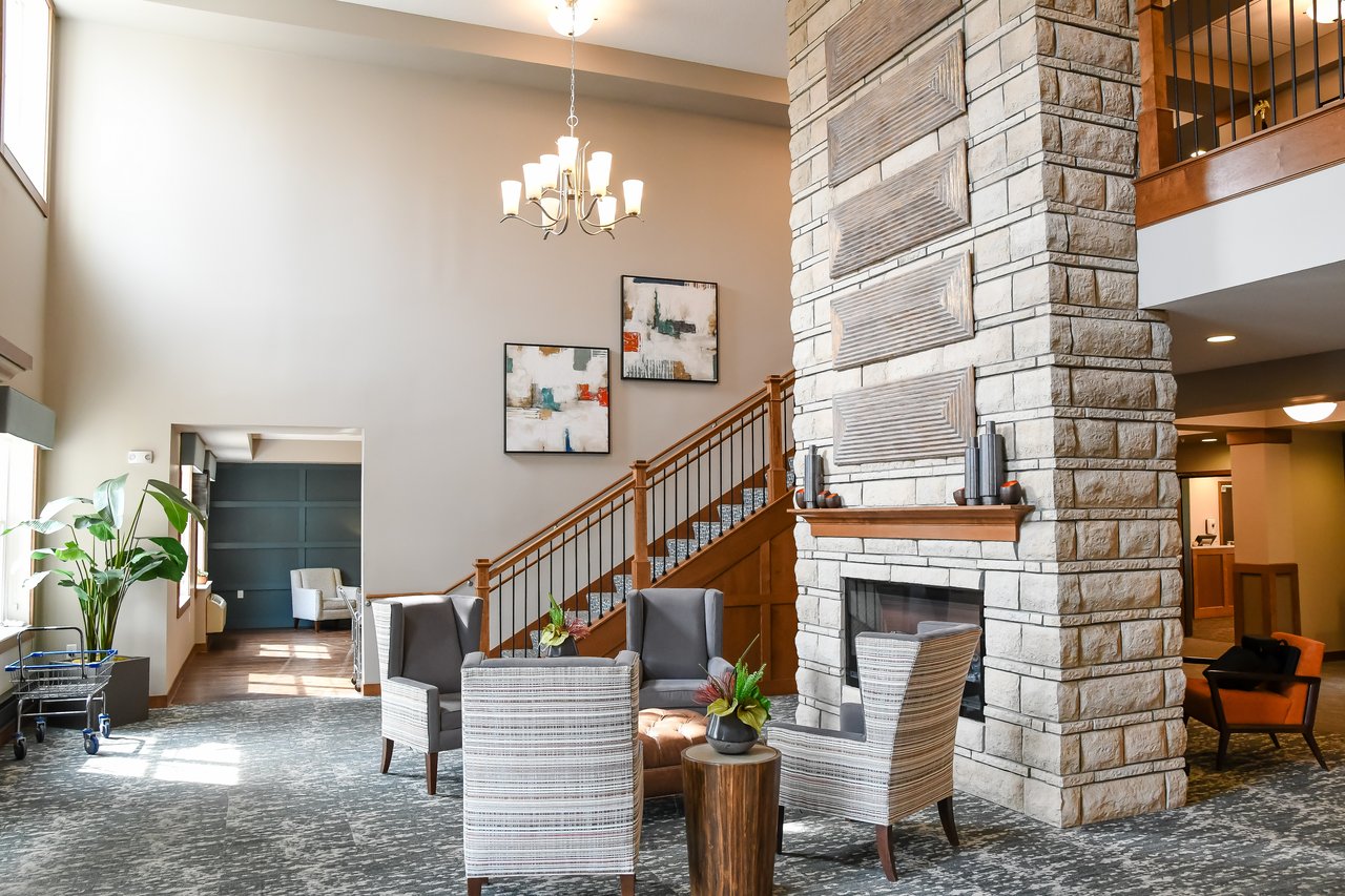 lobby with staircase and fireplace