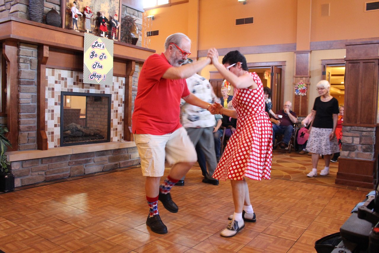 man and woman in red dancing