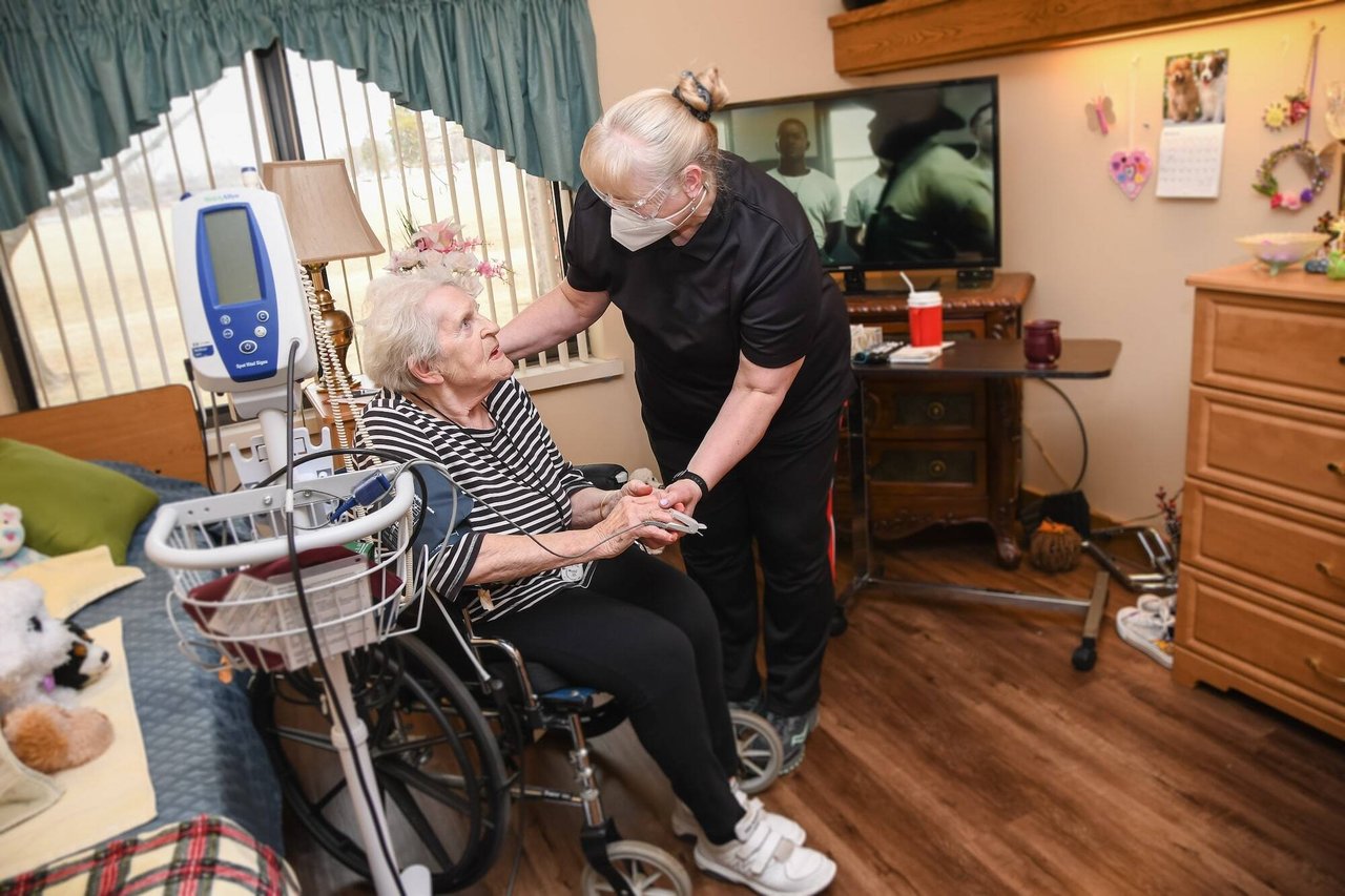 nurse helping woman