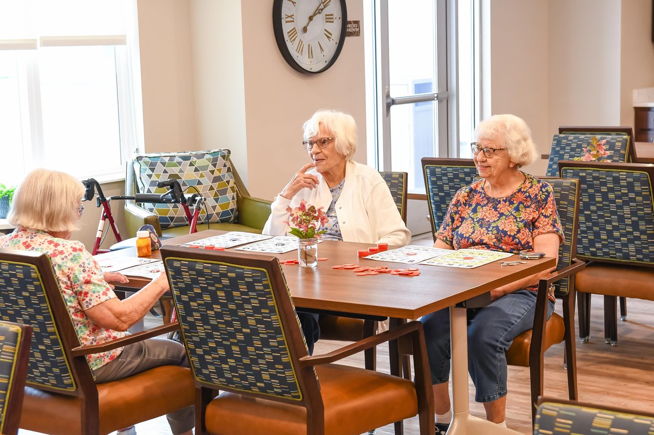 women chatting at large table