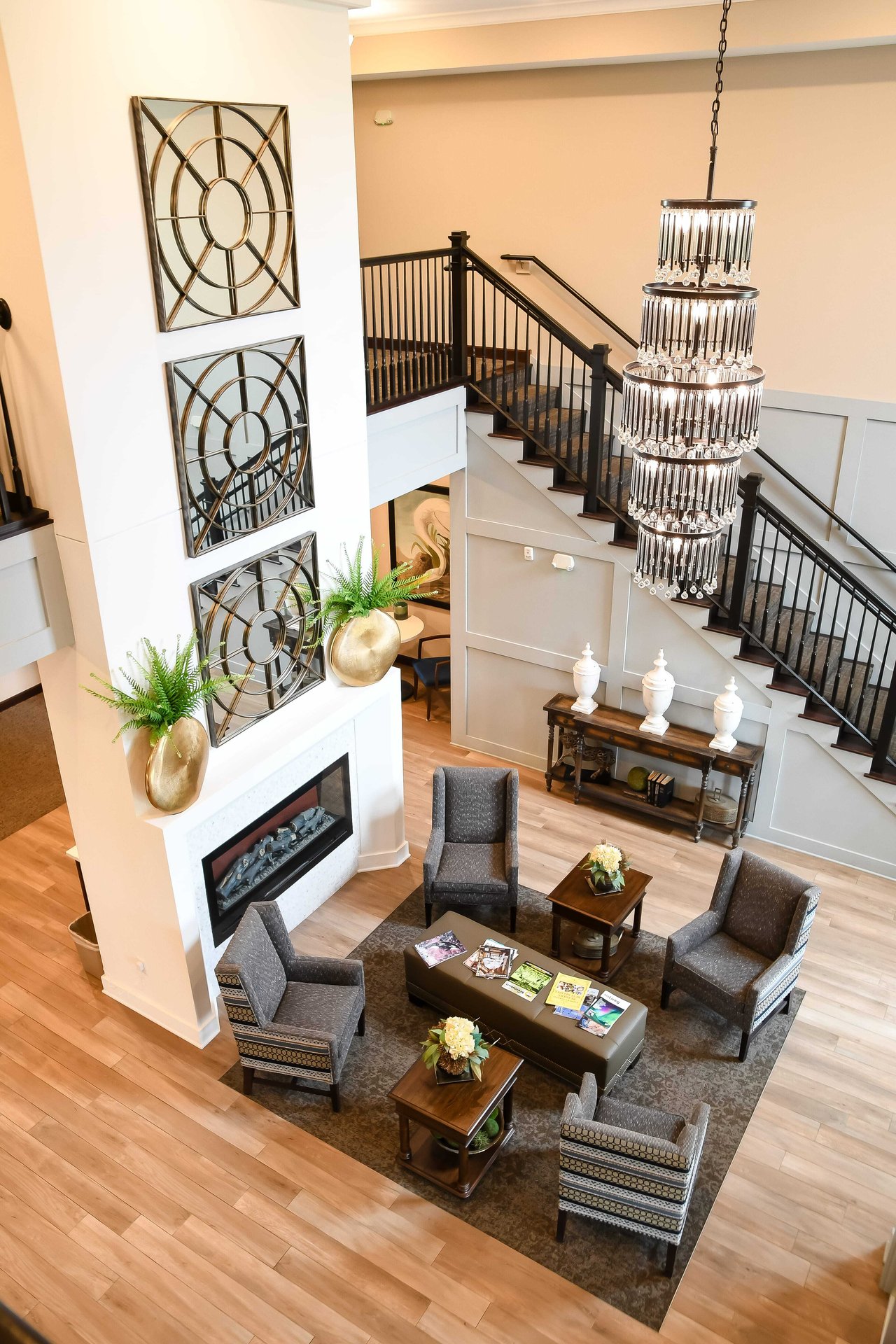 lobby with fireplace and staircase
