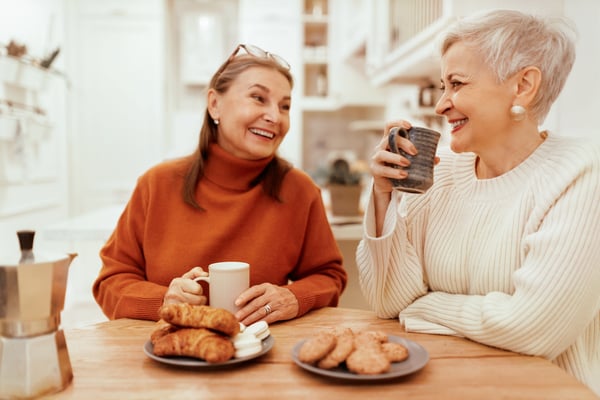 Friends conversing over breakfast